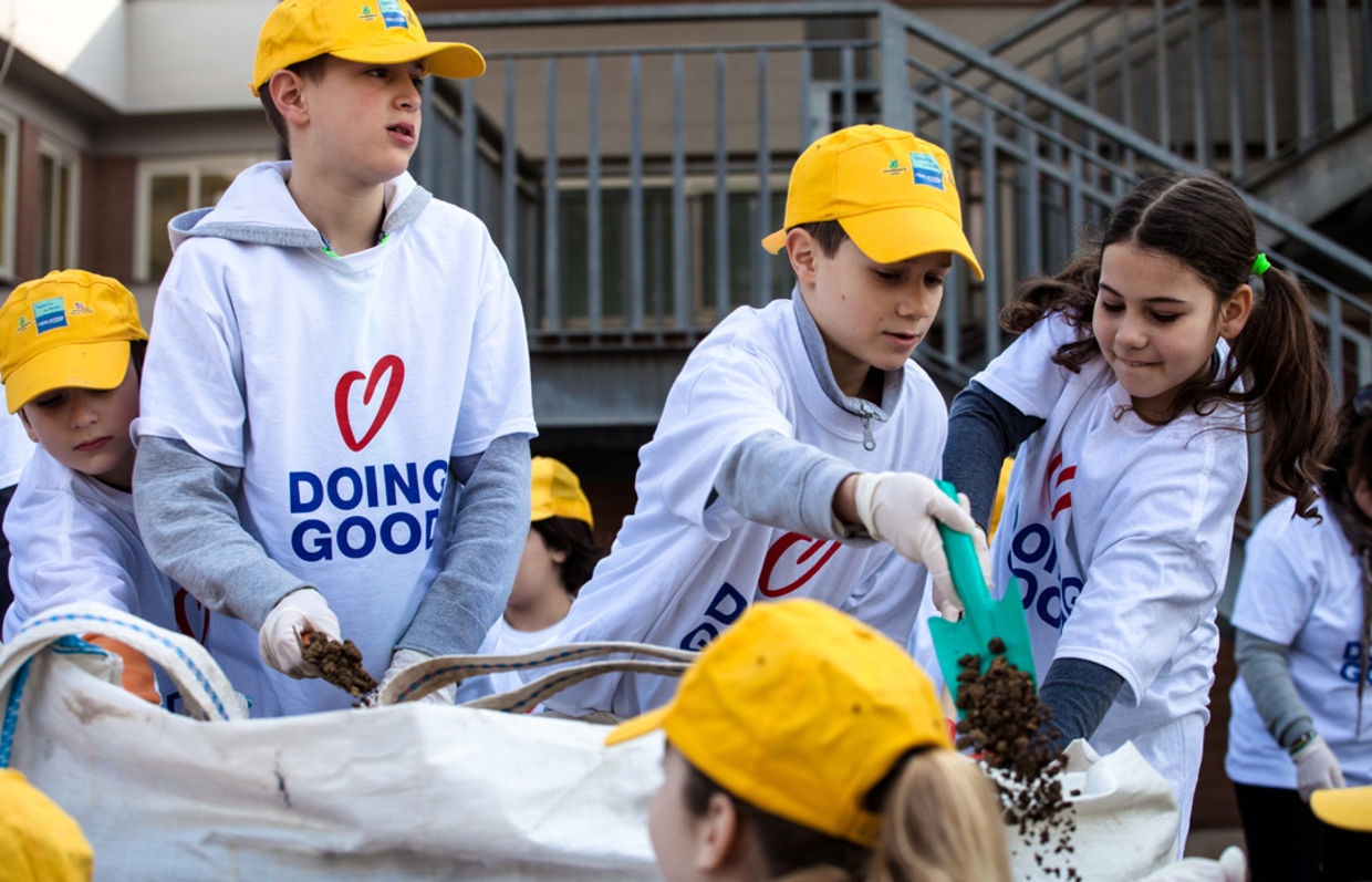 Children beautify a local park in Rome, Italy (Good Deeds Day)