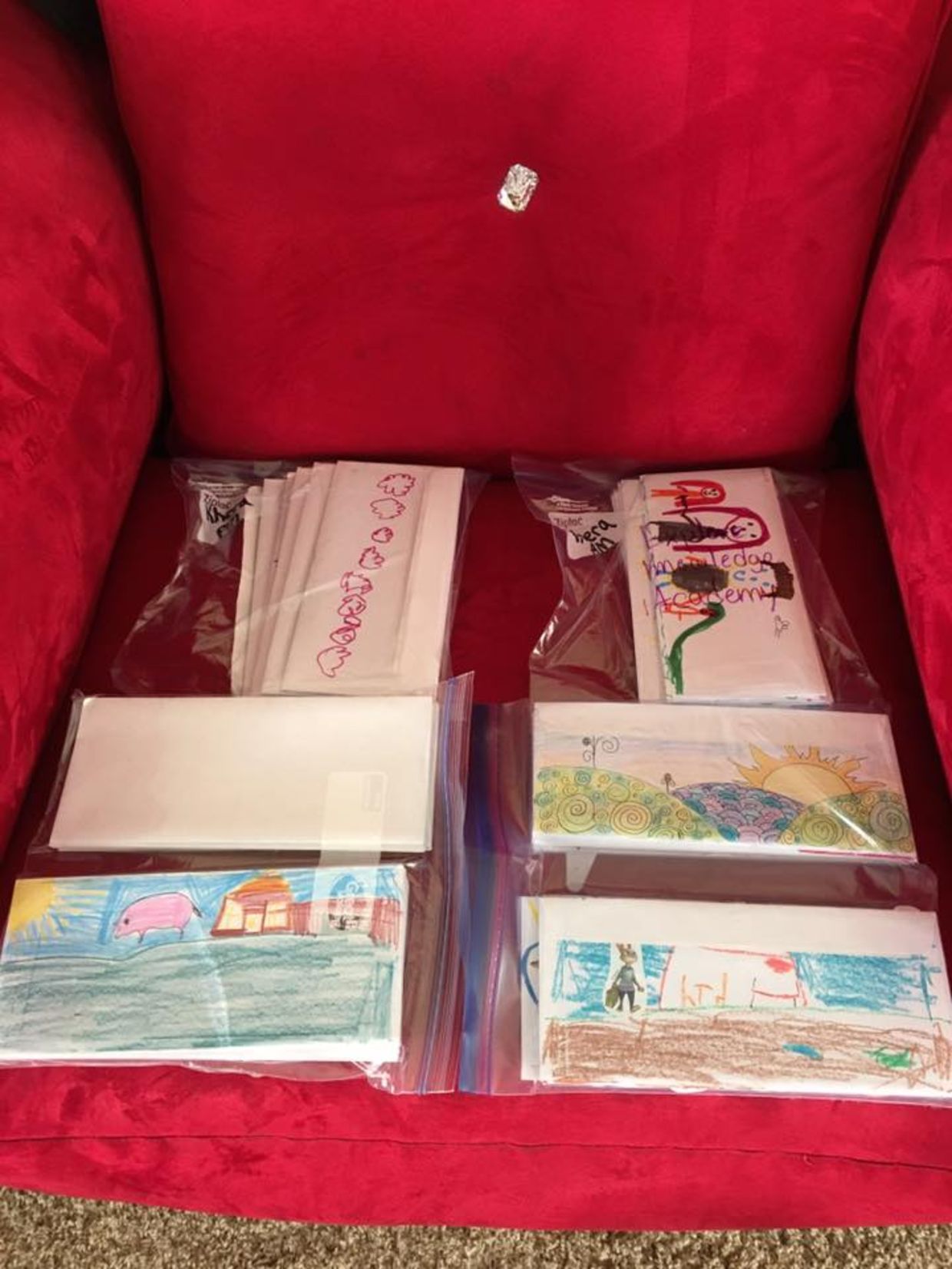 Stacks of letters written by kindergarten students in collaboration with Love for the Elderly