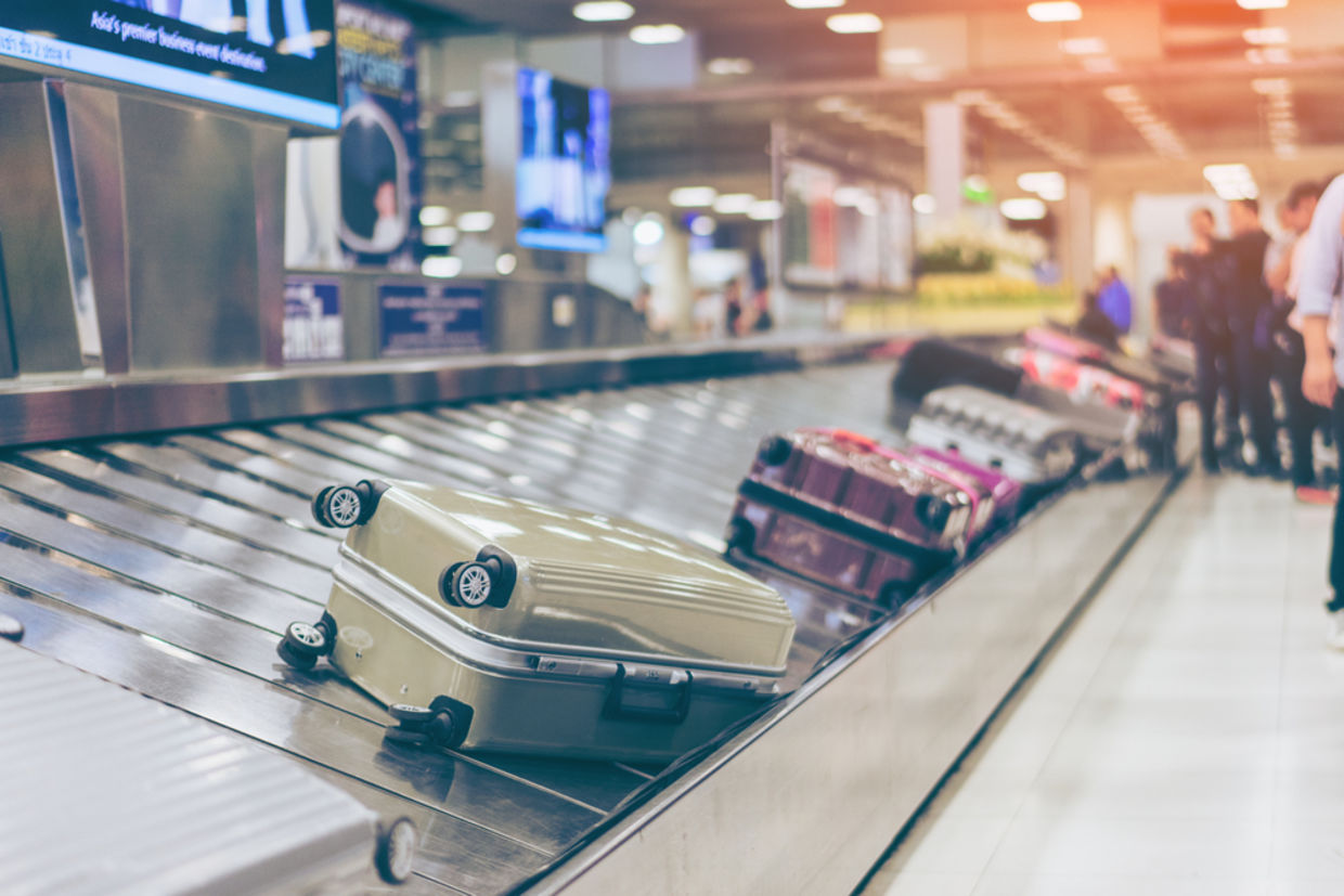 Suitcase or luggage with conveyor belt in the international airport