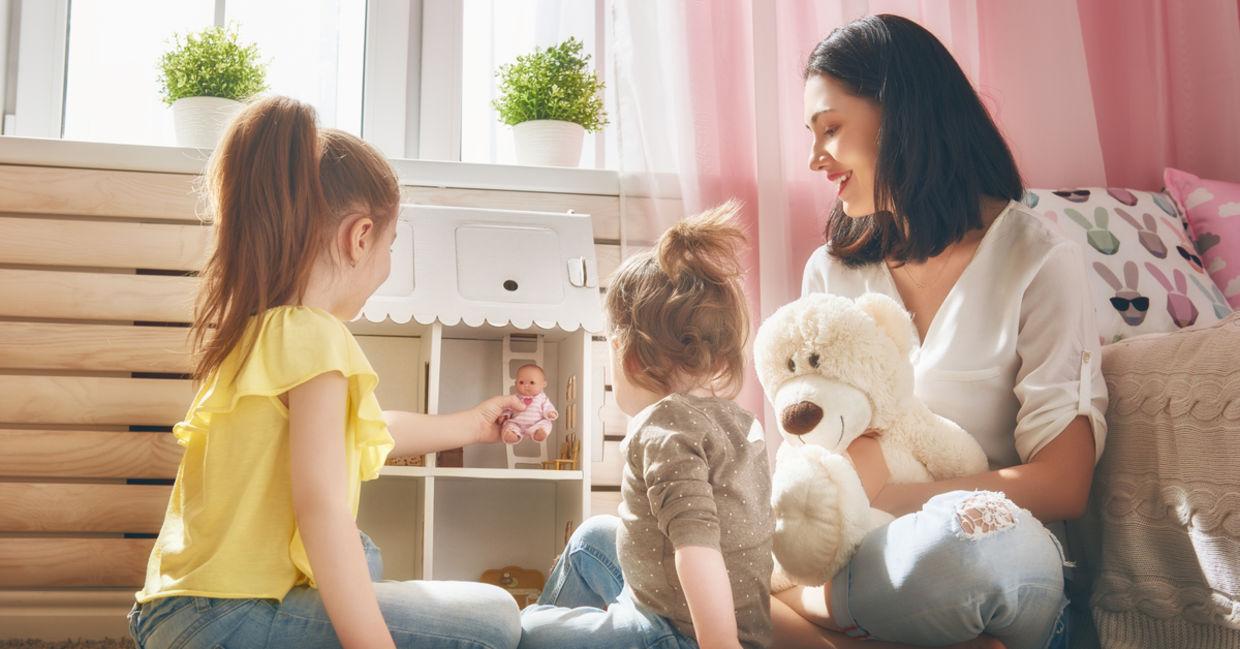 Girls holding lottie dolls