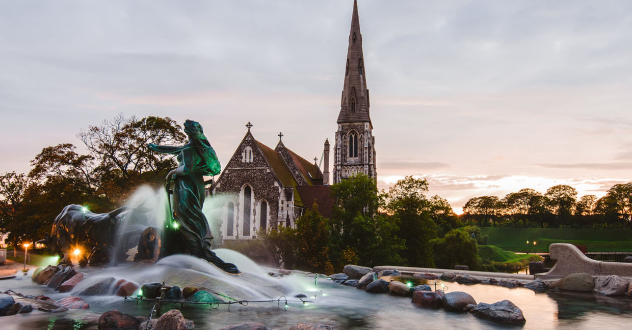 Beautiful sunset St. Alban's church (Den engelske kirke) and fountain in Copenhagen, Denmark
