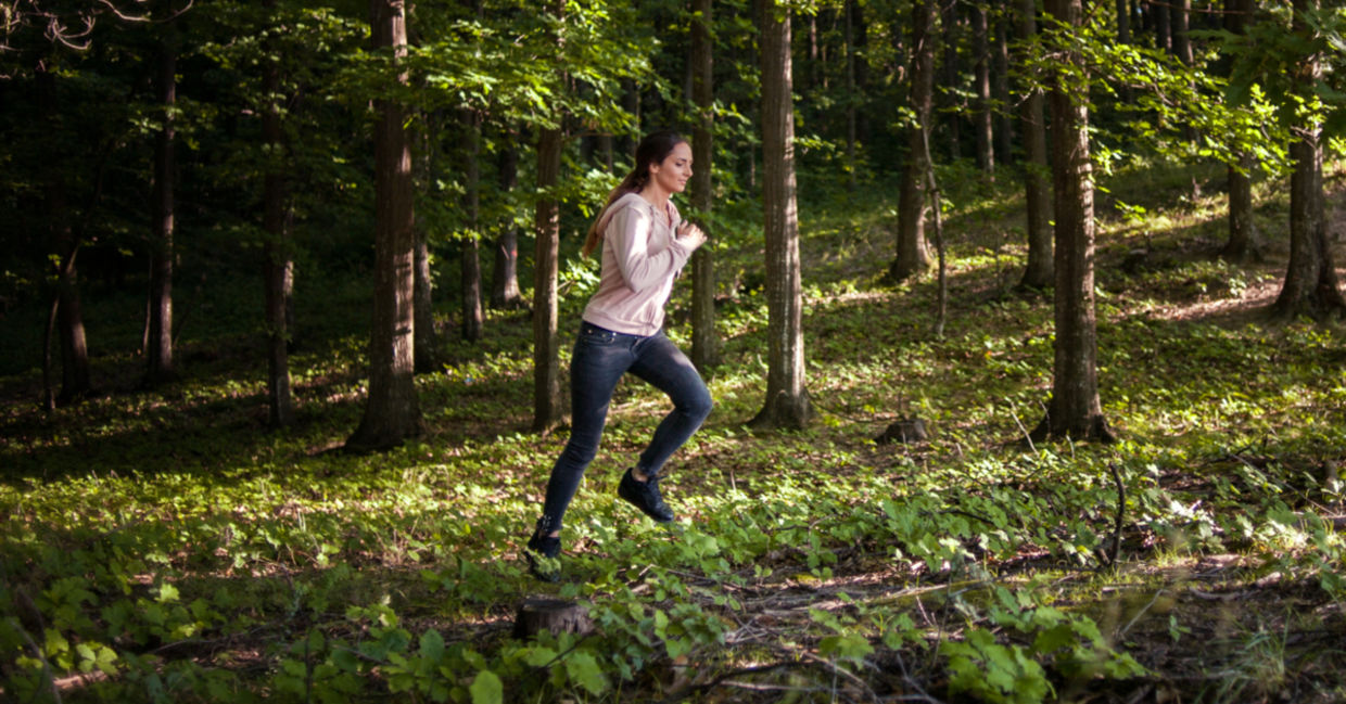 Optimistic healthy woman running