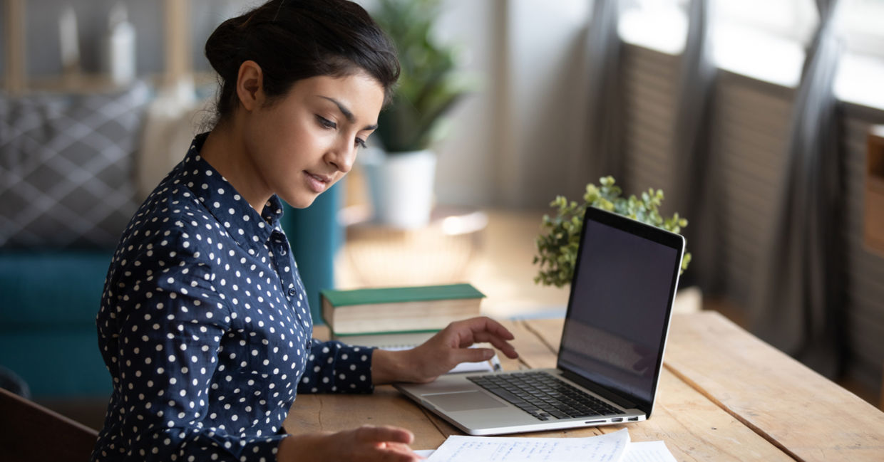 woman concentrating at decluttered desk