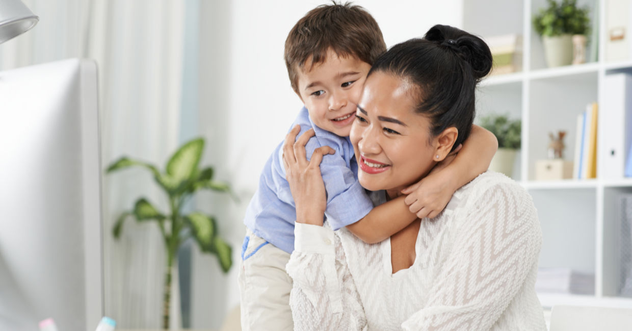 A boy hugs his mother