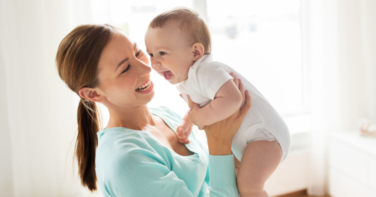 A happy mother and baby playing
