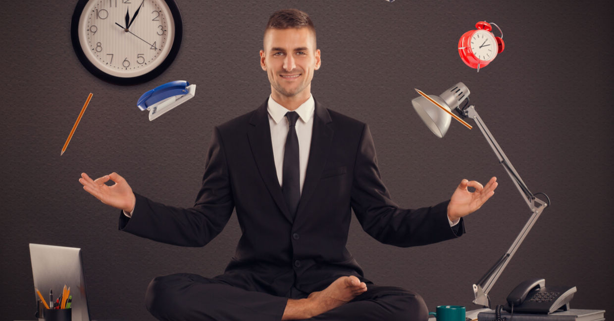 Businessman meditating desk office mindfulness