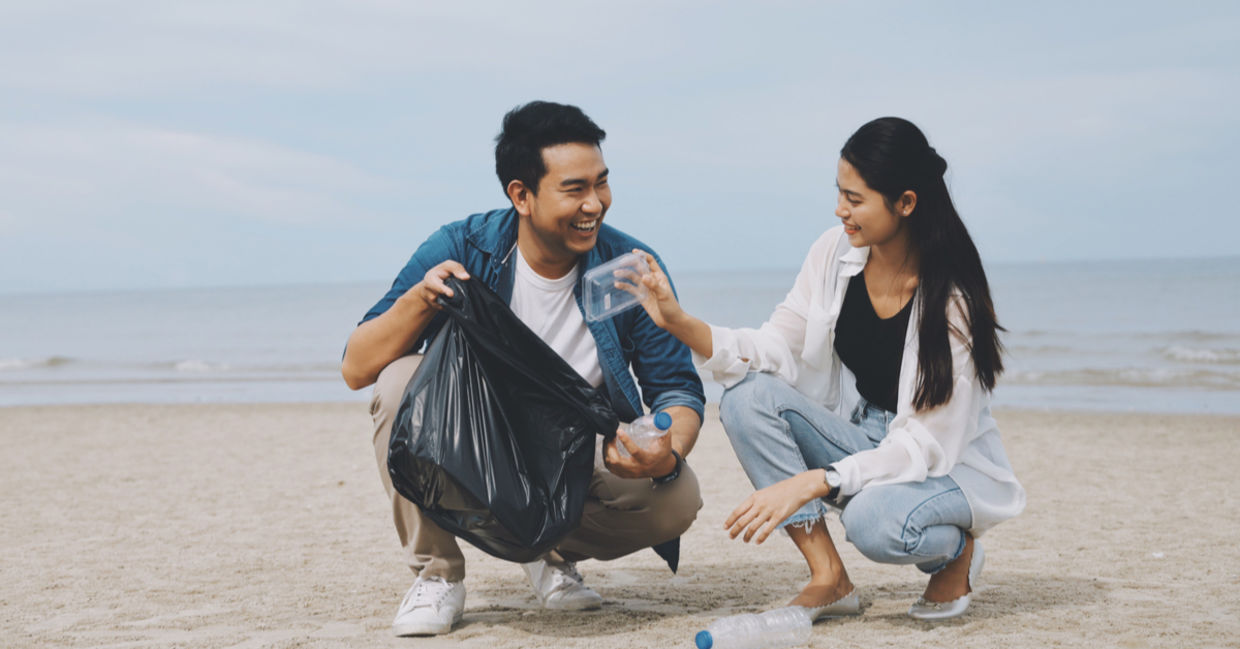 Couple picking up litter together