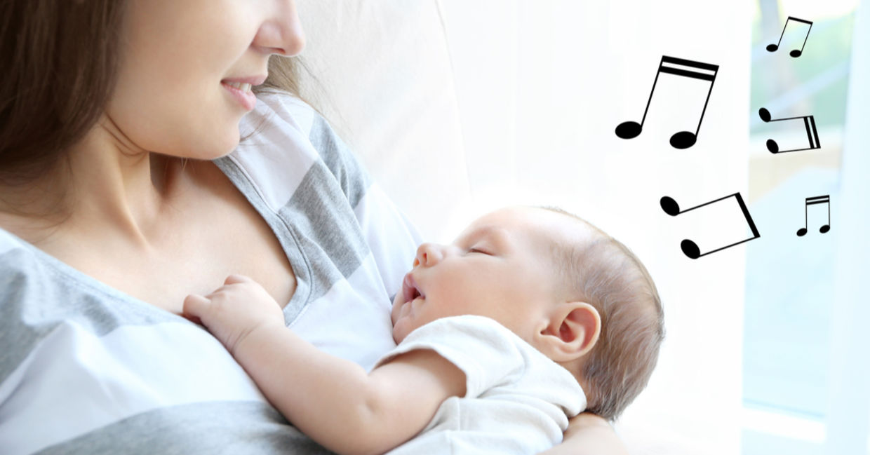 Young mother sings a lullaby to her baby.