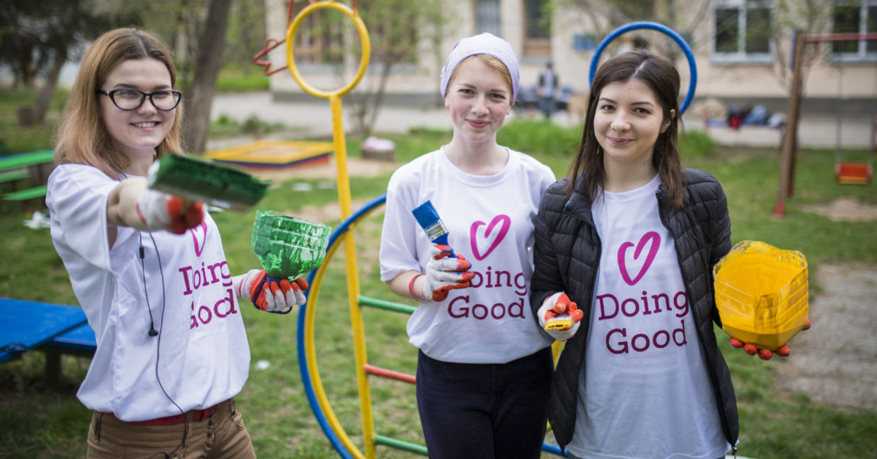 Volunteers sprucing up a playground.