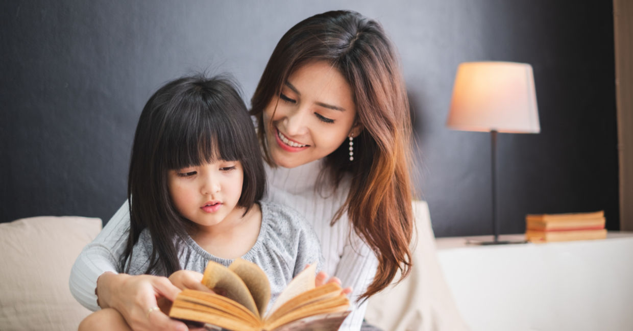 Mother reading to child.