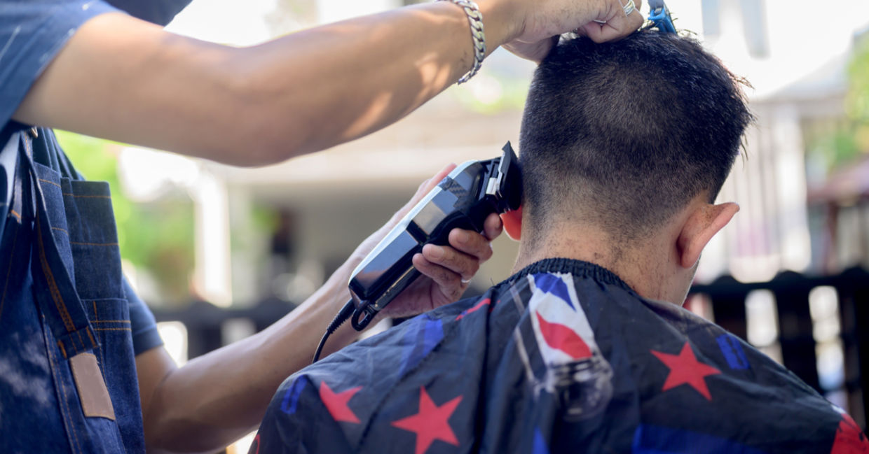 Cutting hair outside.