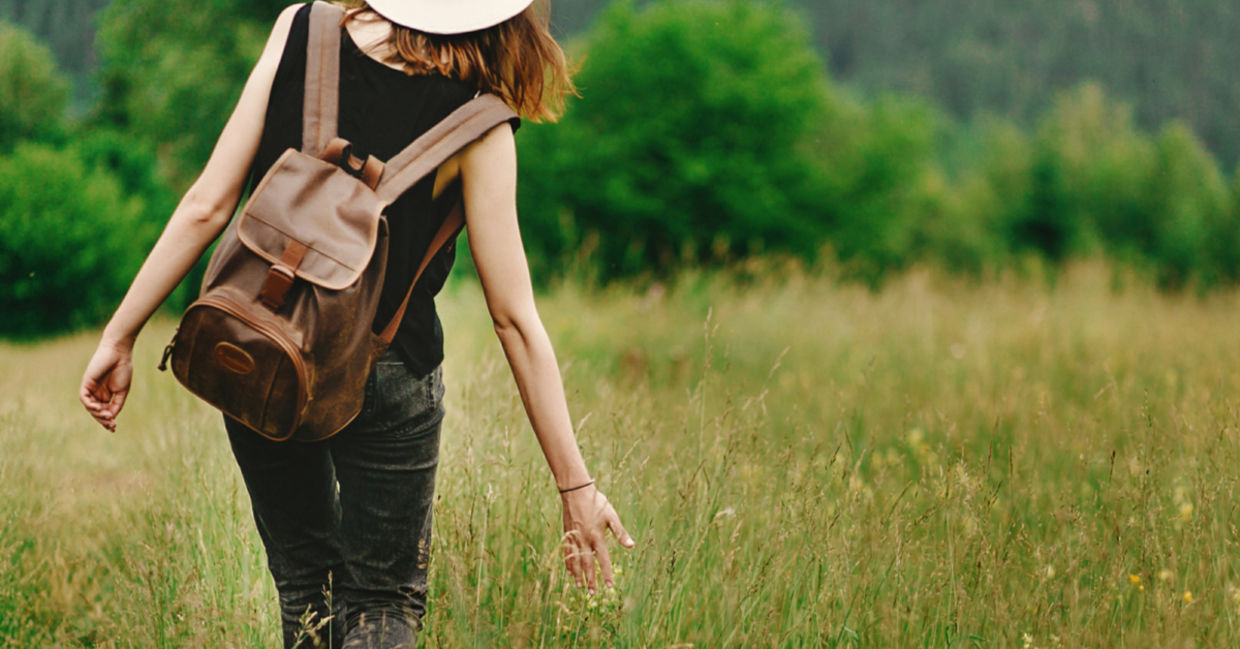 Woman walking outdoors to show intrinsic motivation