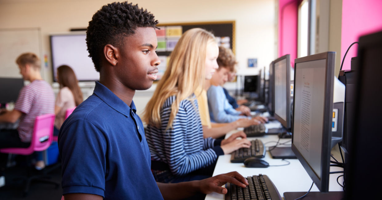 Teenagers learning coding.