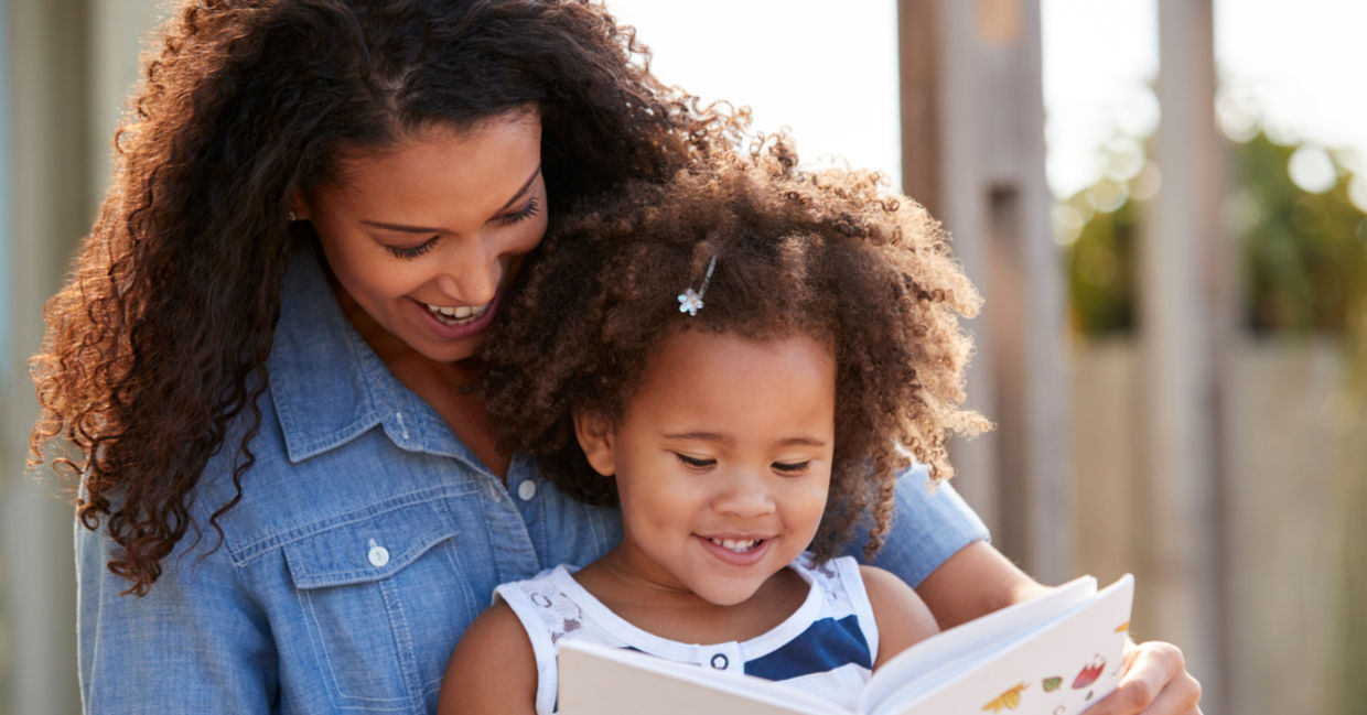 Mother reading epic books for kids  about women's history.