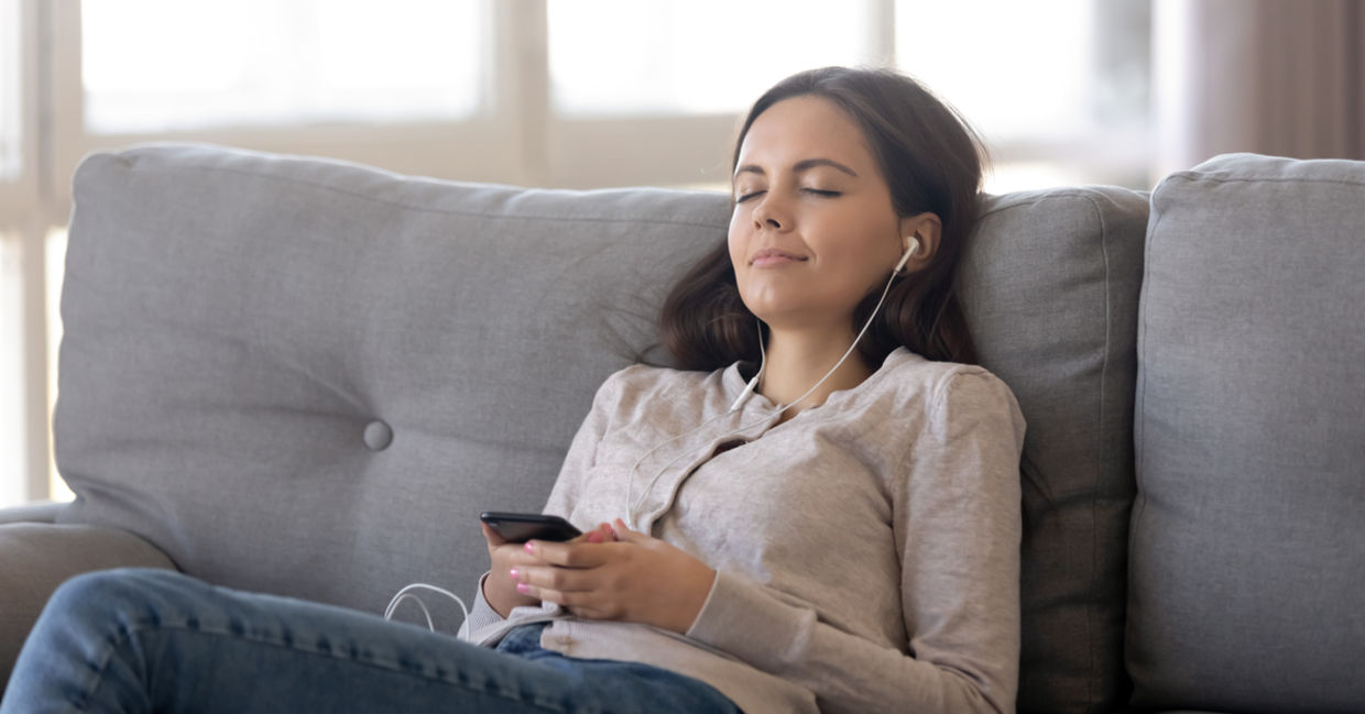 Woman listing to relaxing sleep music.
