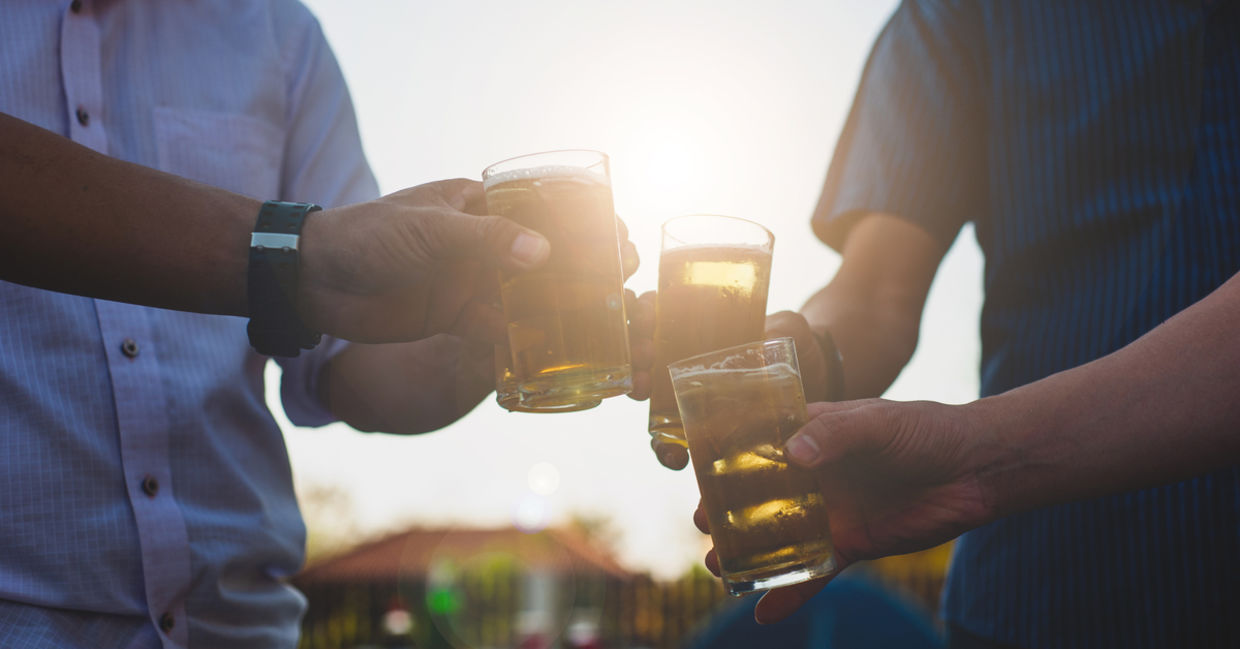 Colleagues drinking a beer together
