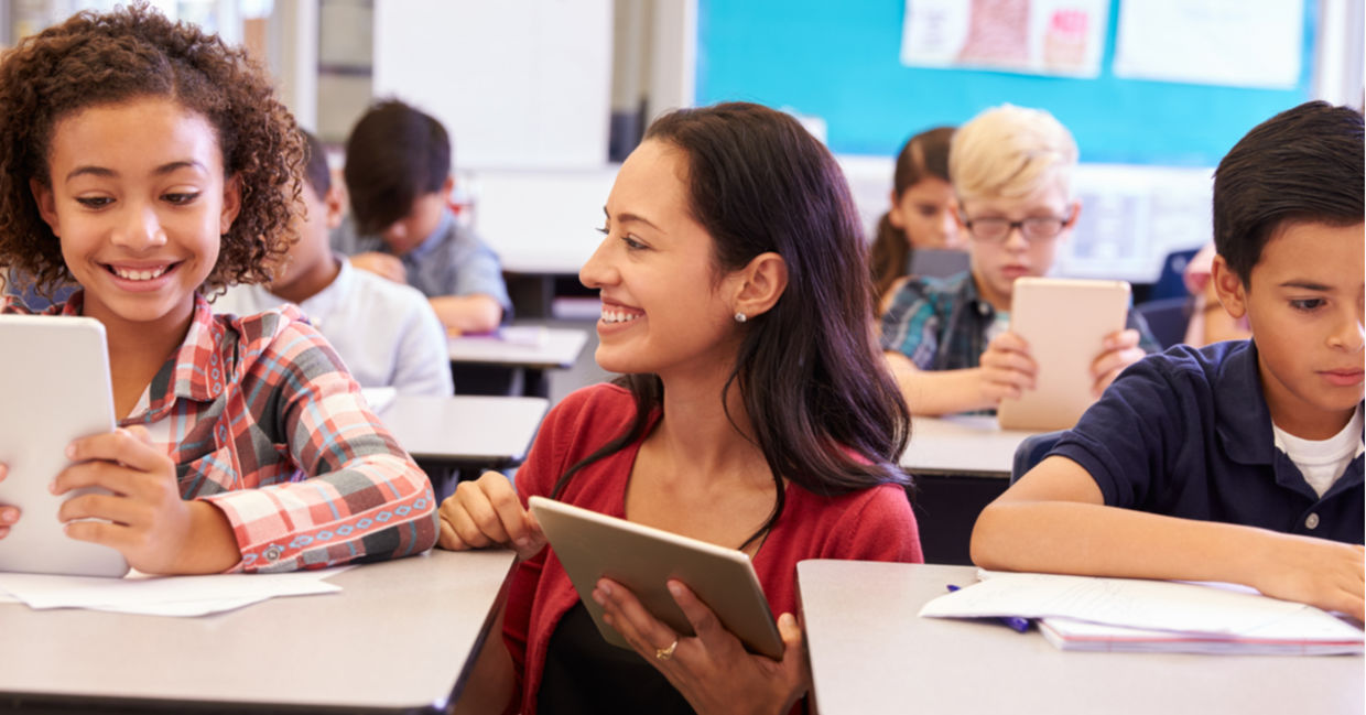 kids in a classroom on tablets