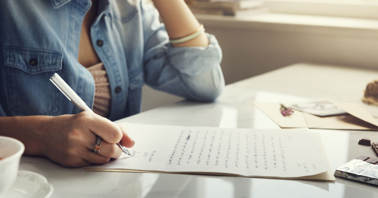 A woman writing a letter