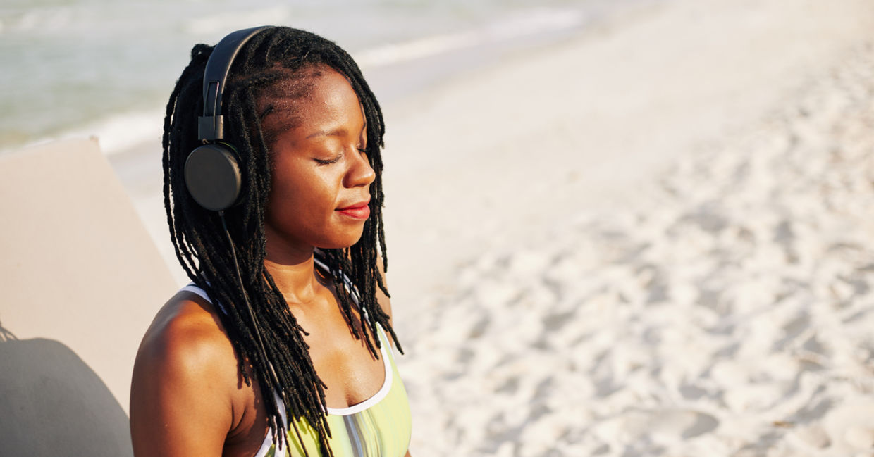 A woman listens to music