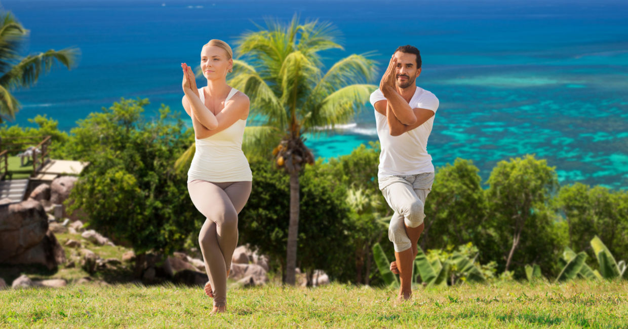 This couple is doing the eagle pose.