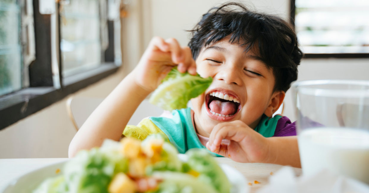 A boy enjoying his food