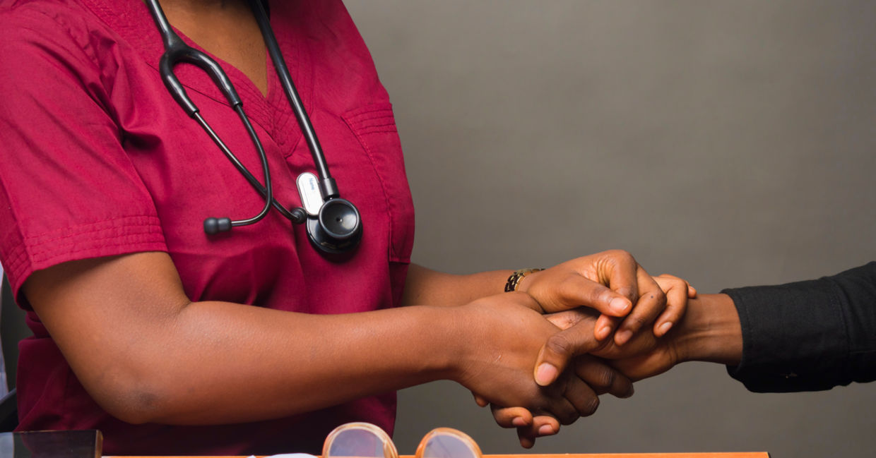 Surgeon or doctor with patient.