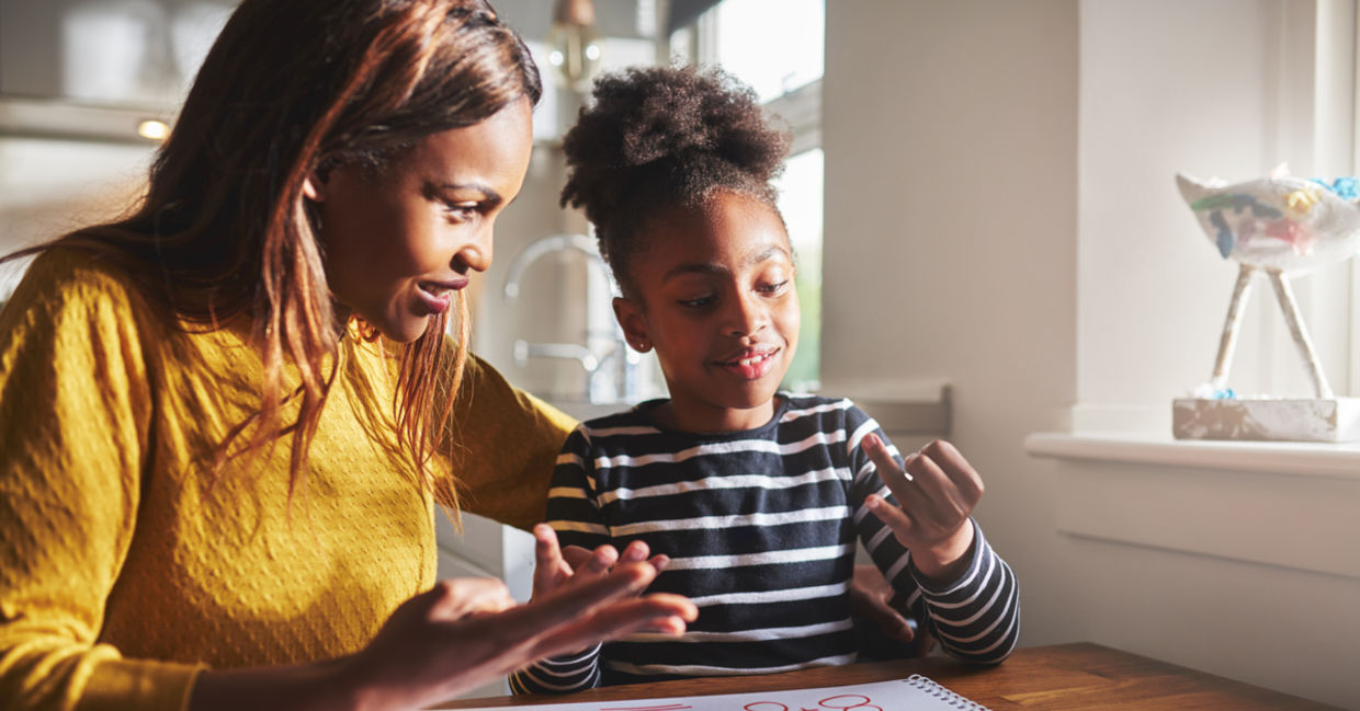 Mother praising her daughter's efforts.