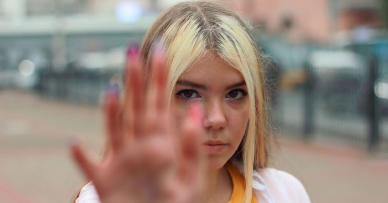 Assertive girl saying no to bullying.