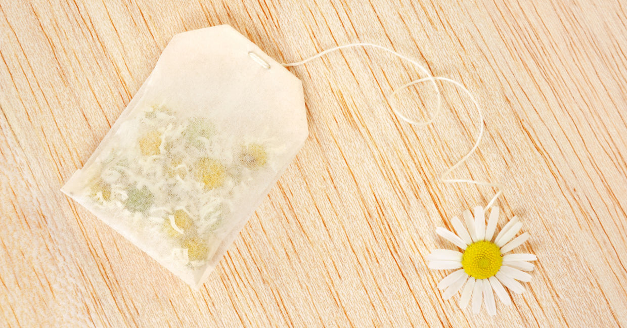 Chamomile tea bag and flower