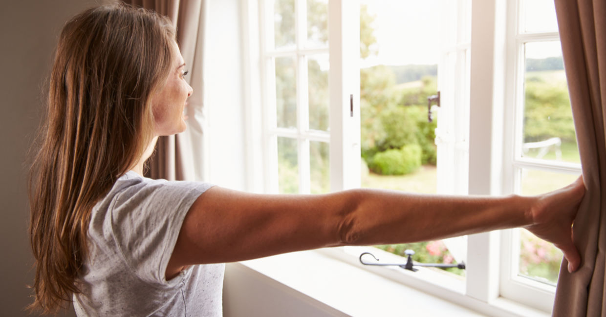 Woman thinking about her goals by a window