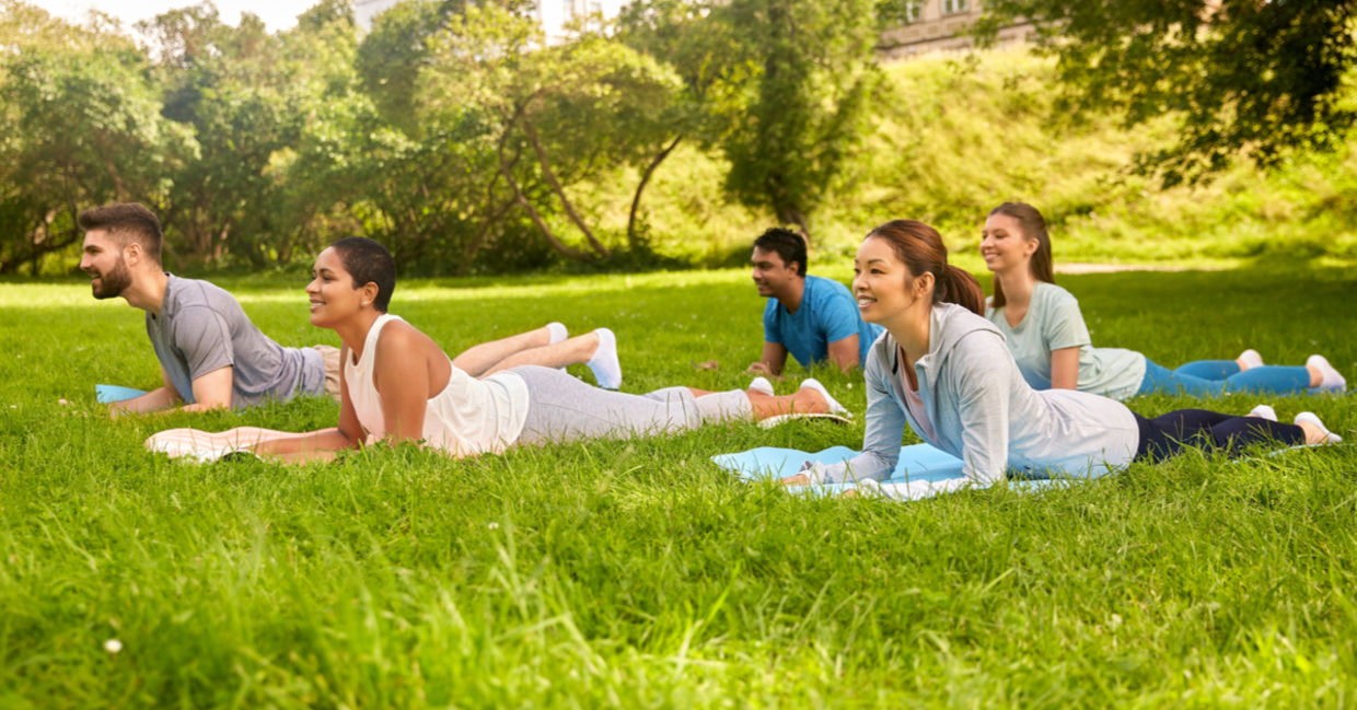 Yoga class doing the sphinx pose.