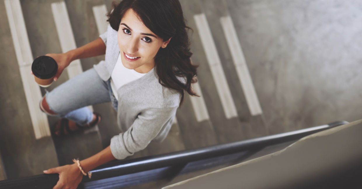 A woman exercises by taking the stairs.