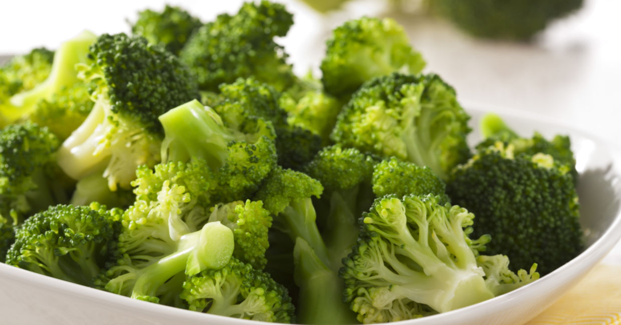 Chopped, steamed broccoli in a bowl.