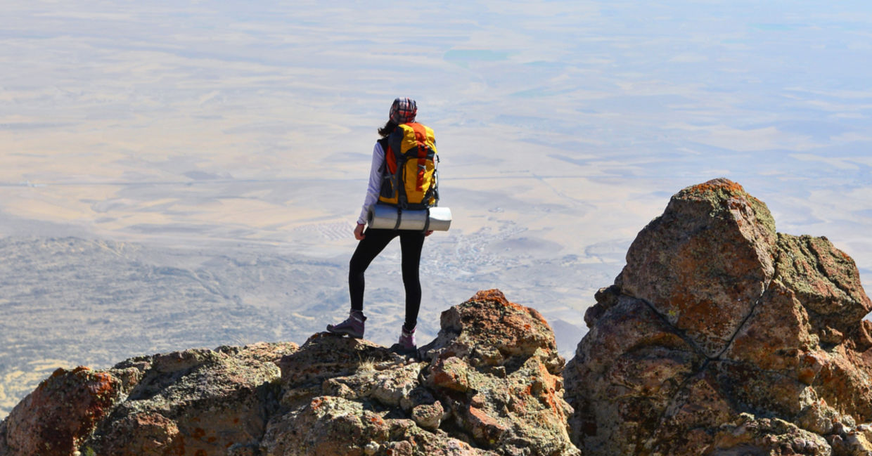 Self-confident woman makes it to the summit.