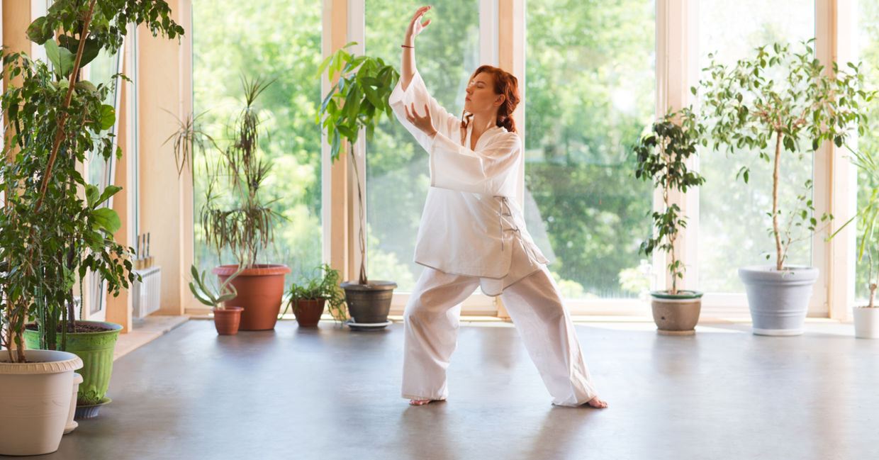 A woman practicing tai chi.