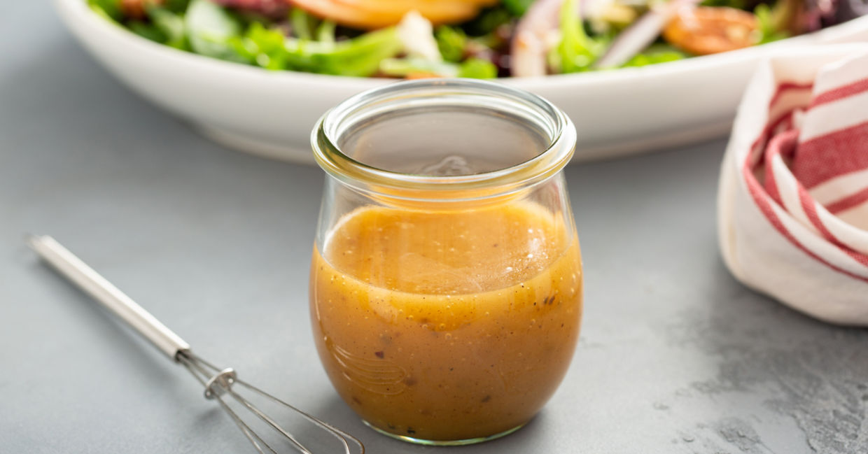 Apple vinaigrette dressing in a mason jar.