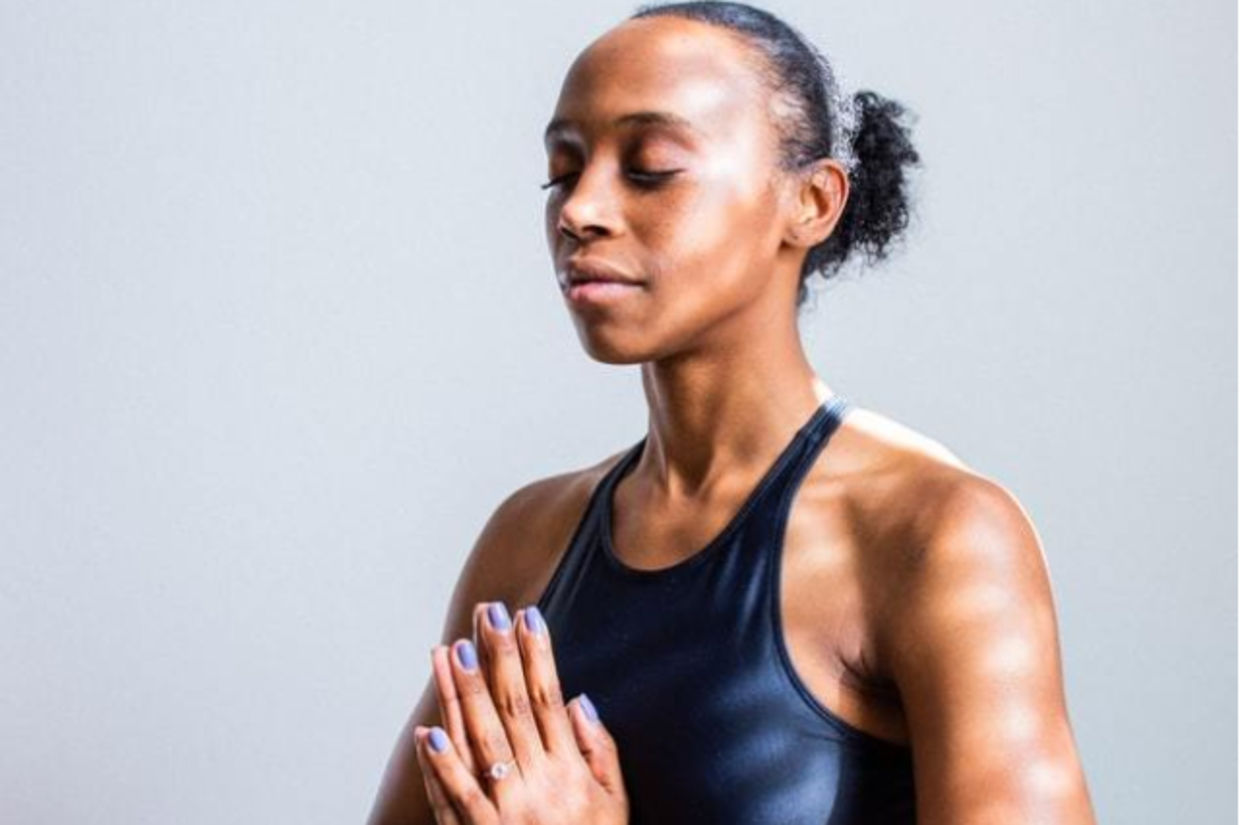 Woman doing the pose of Ausar.