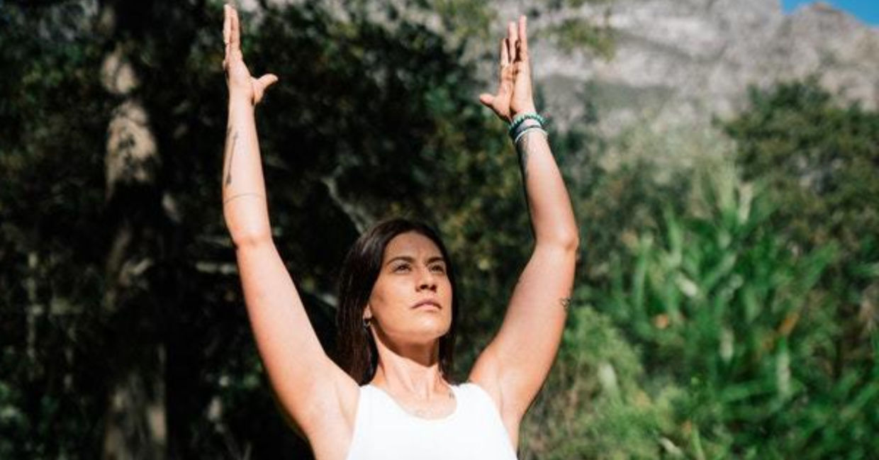 Woman in the kemetic yoga Ka pose