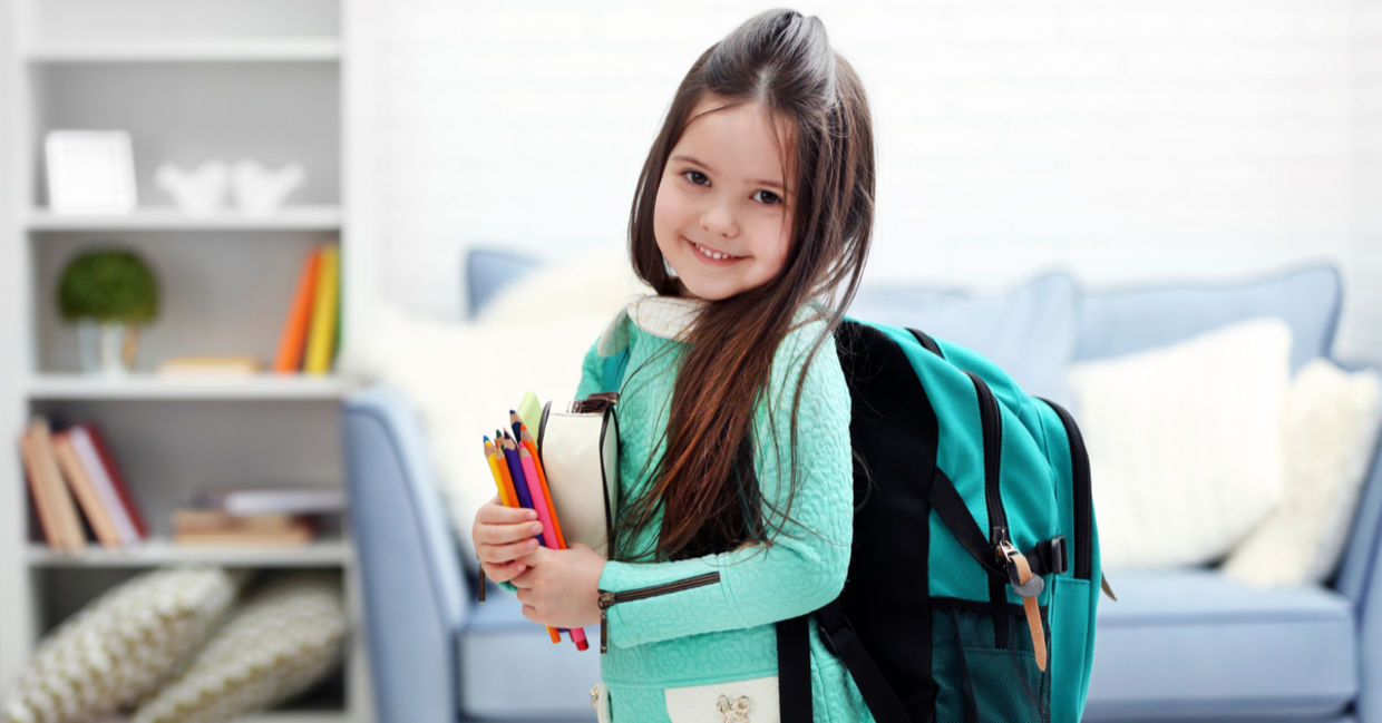 Little girl heading to her first day back at school