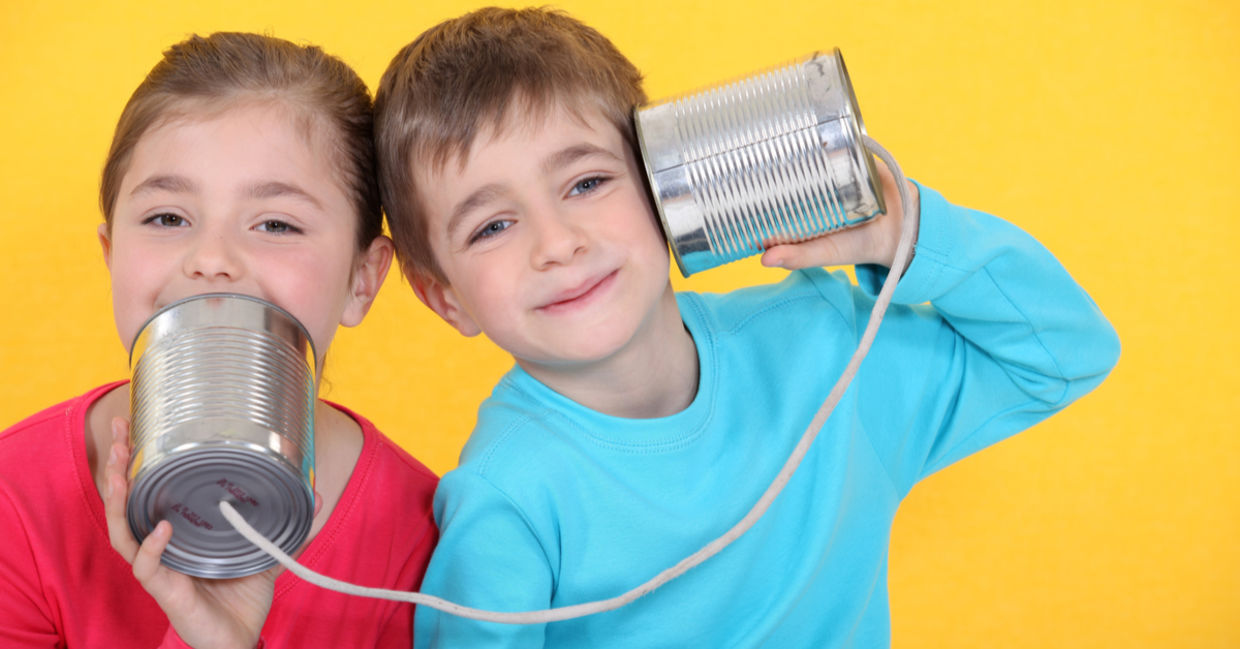 Kids having a phone call with tin cans