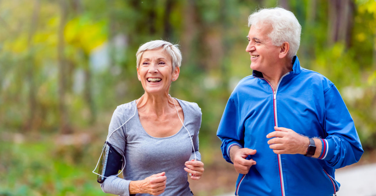 Two seniors running in the morning.