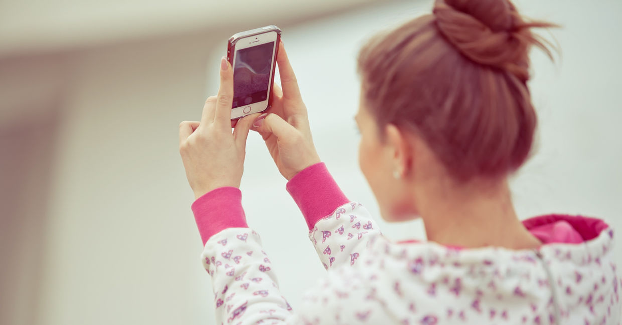 Girl taking a selfie.
