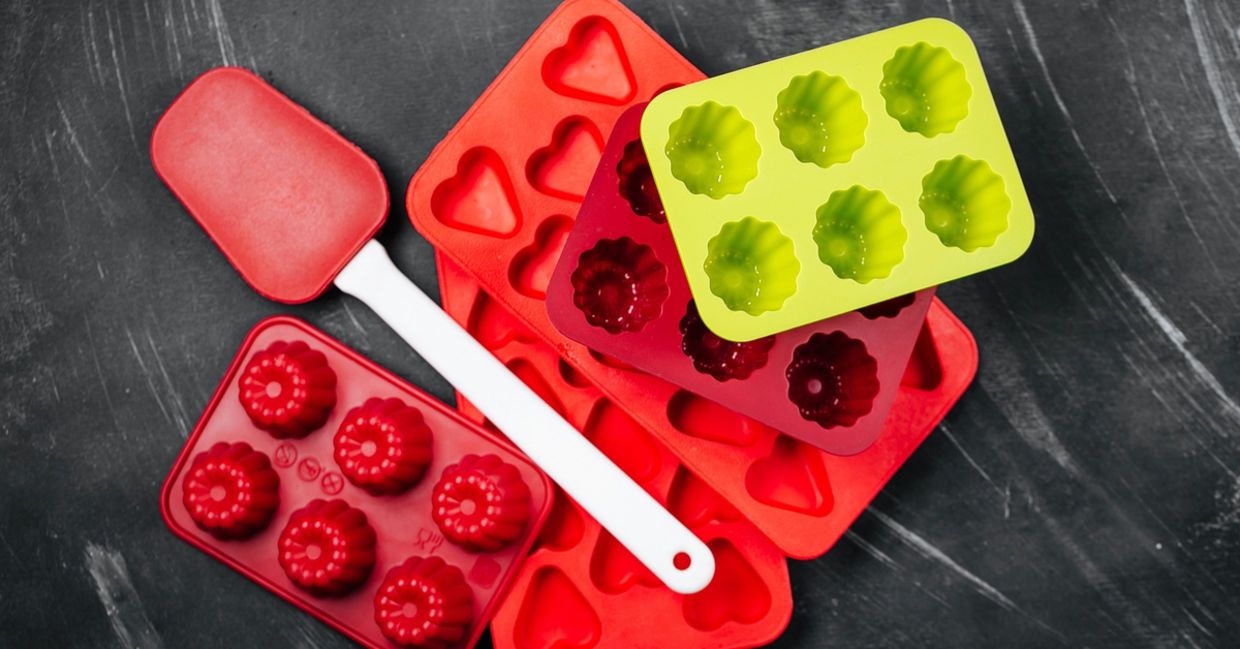 Various silicone molds and spatulas, ready for chocolate and candy-making.