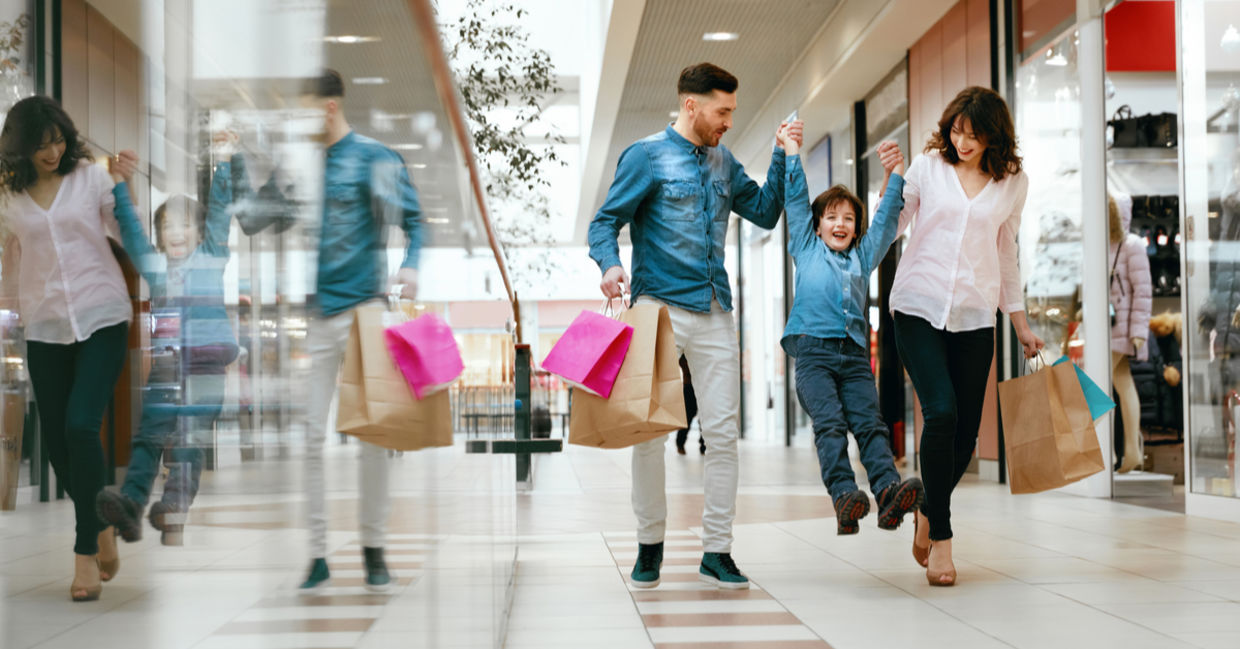 Happy family shopping in mall