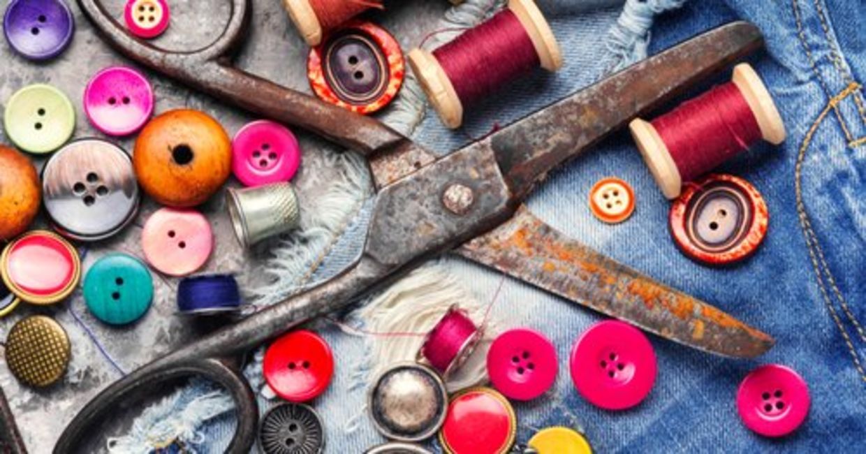 Thread, buttons, and scissors mend and repurpose clothes.
