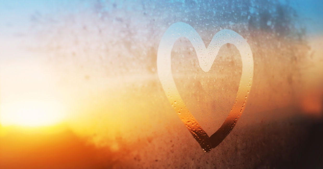 Heart painted on a window in winter