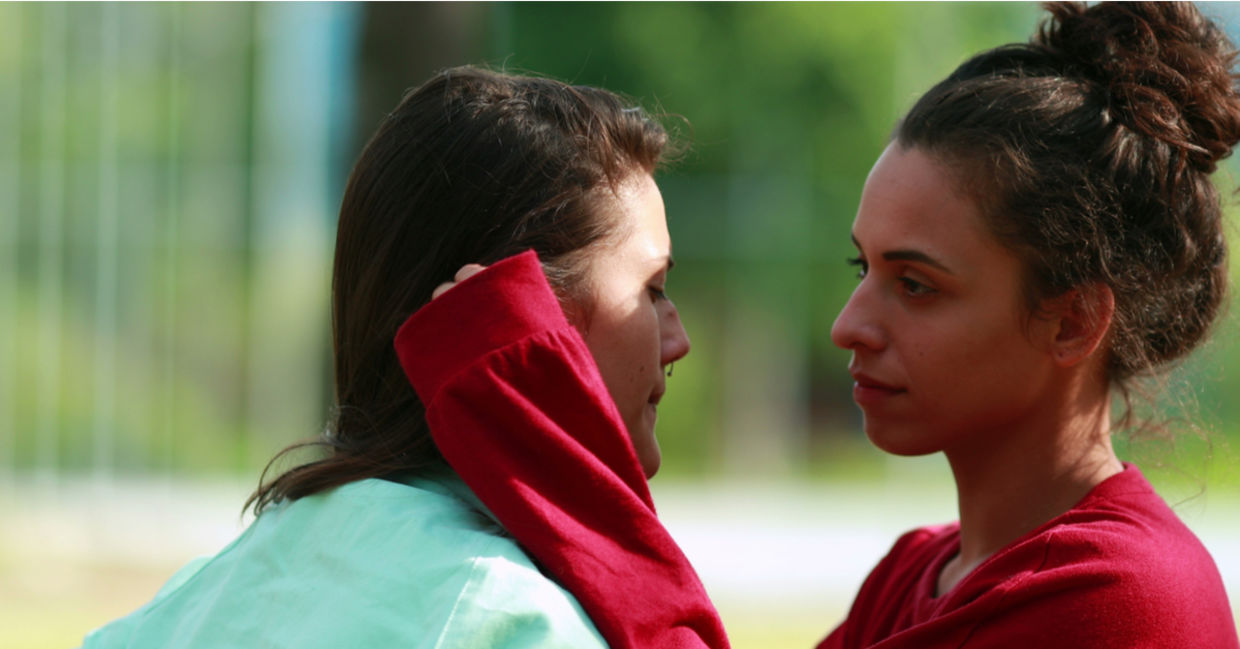 A physical empath holds another person, offering an empathic touch.