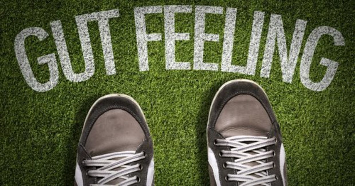 Sneakers in front of the words “Gut Feeling” denote follow your inner knowing!