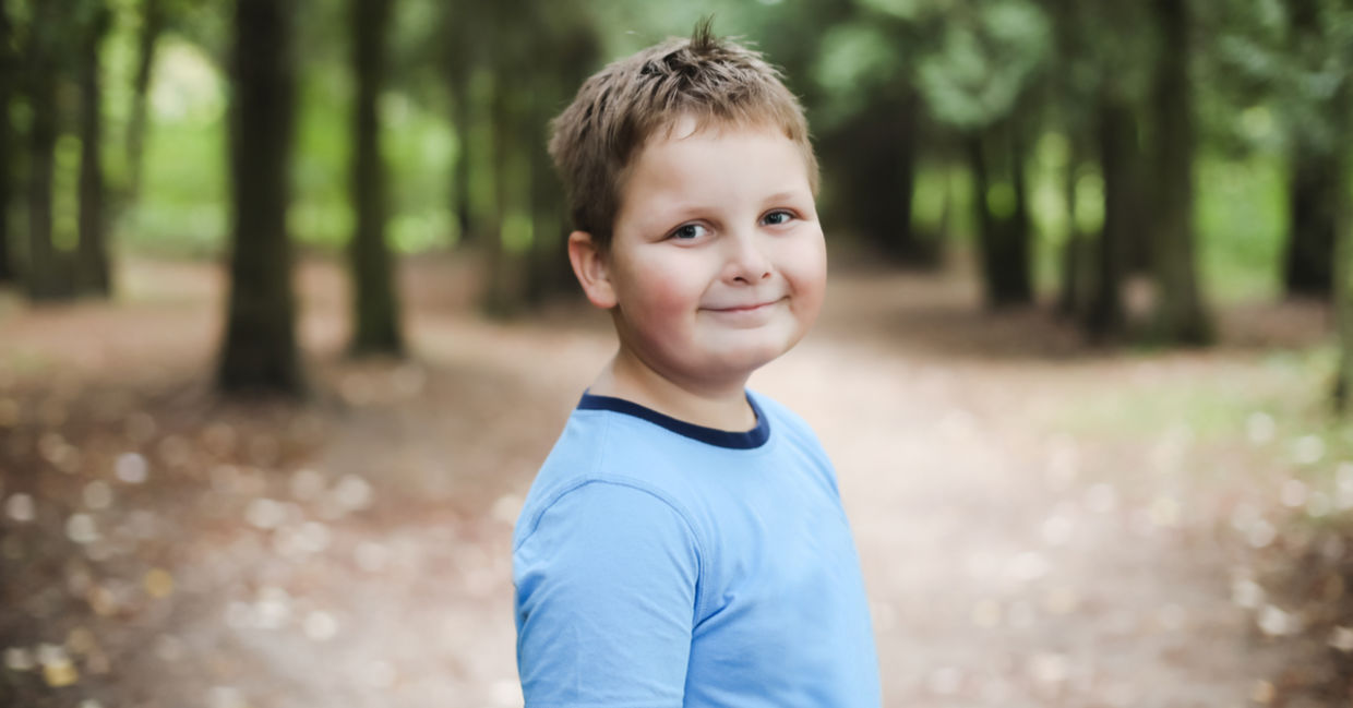 Smiling boy in a park