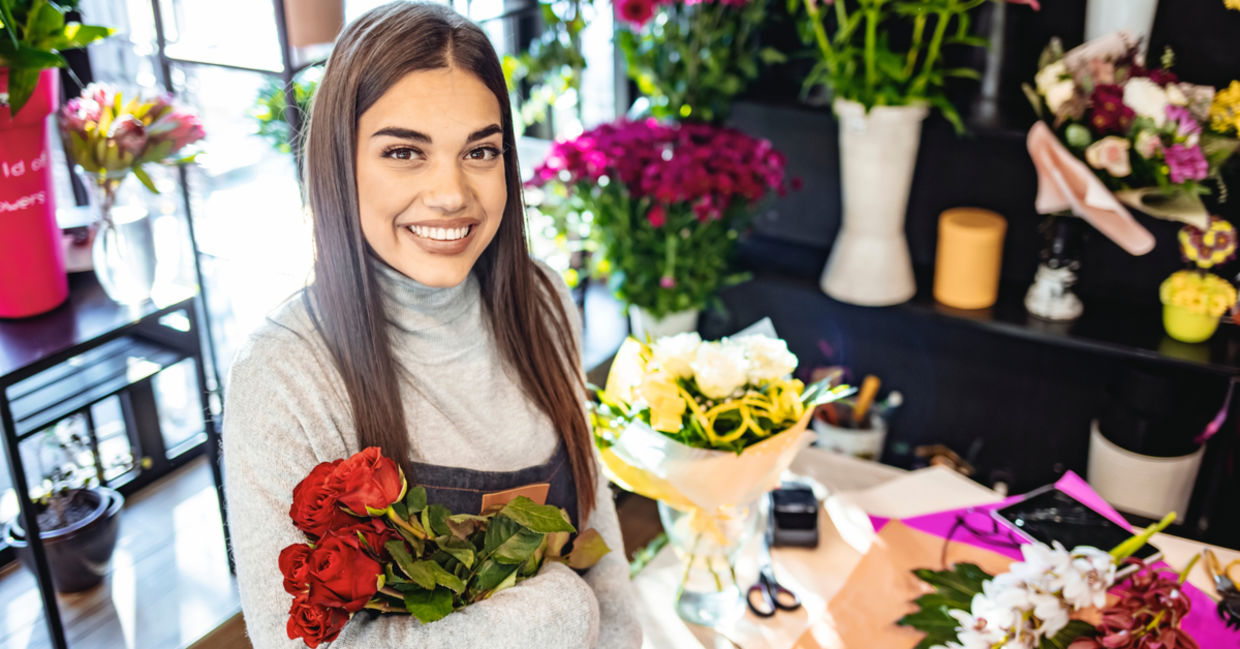 Young woman enjoying learning about flower arranging